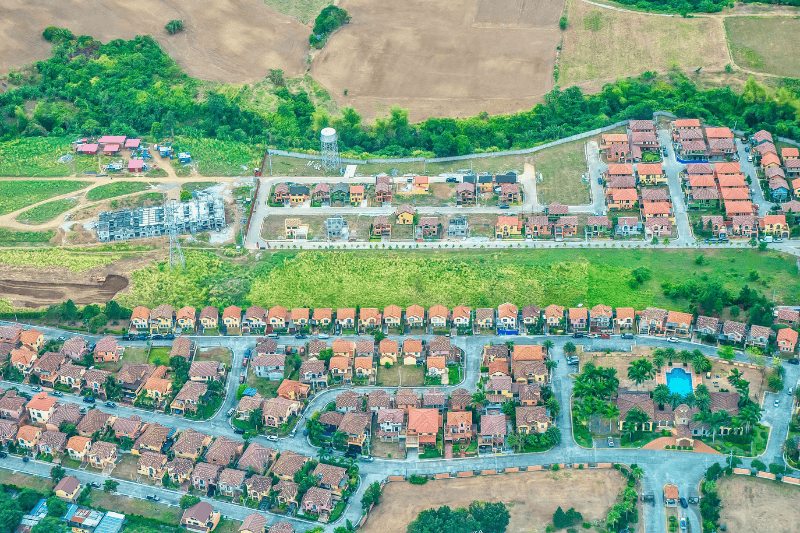 an overhead view of housing developments in various stages