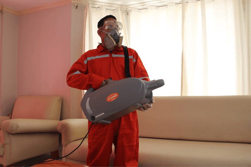 technician using misting to eliminate flying and crawling insects