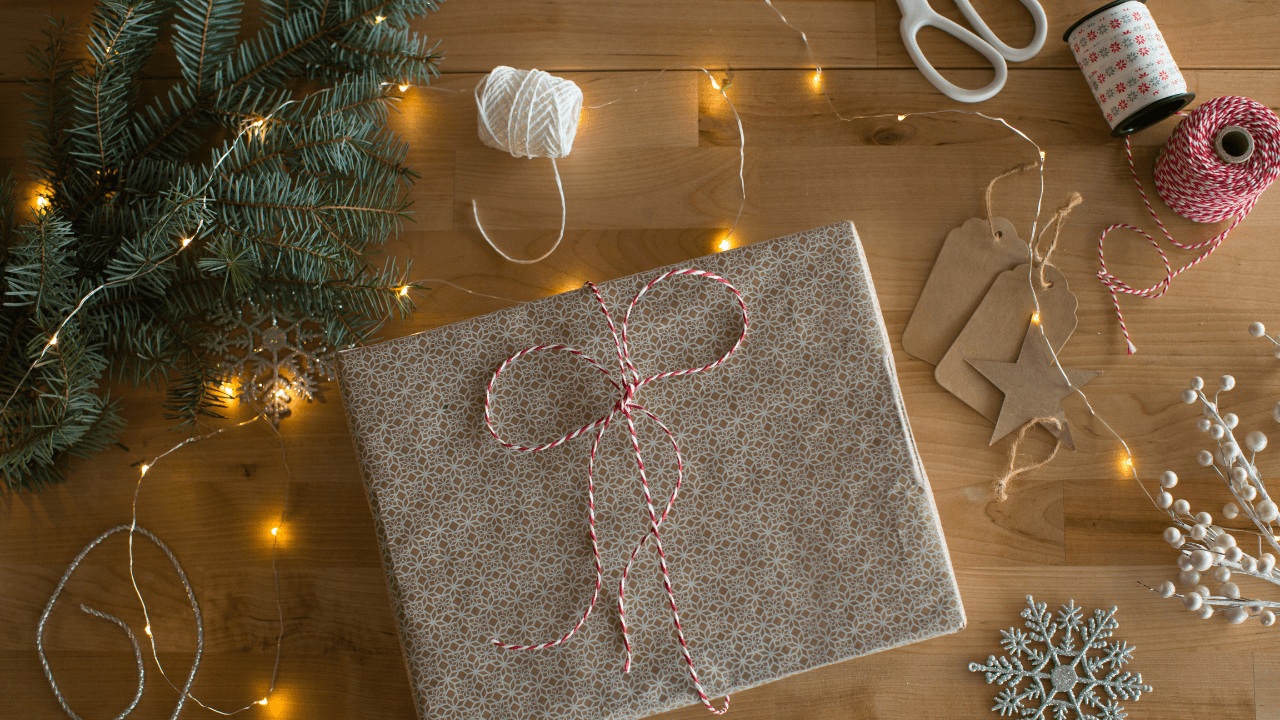 a wrapped present with string and string on a table
