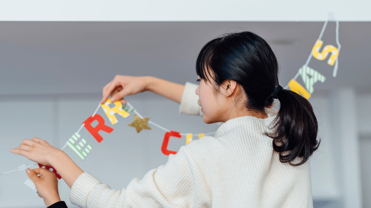 a person holding a garland for Ber months preparation