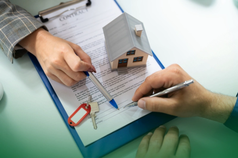 Property Management Companies signing property deed and loan document.