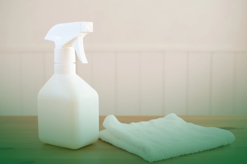 Vinegar Spray cleaning spray bottle and cloth on a table