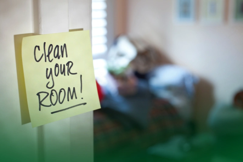 Give Your Home a Good Cleanup_ Make Room for Good Vibes Start the Year Right: Your Easy Guide to a New Year 2024_A sticky note from your parents on a bedroom door exterior.