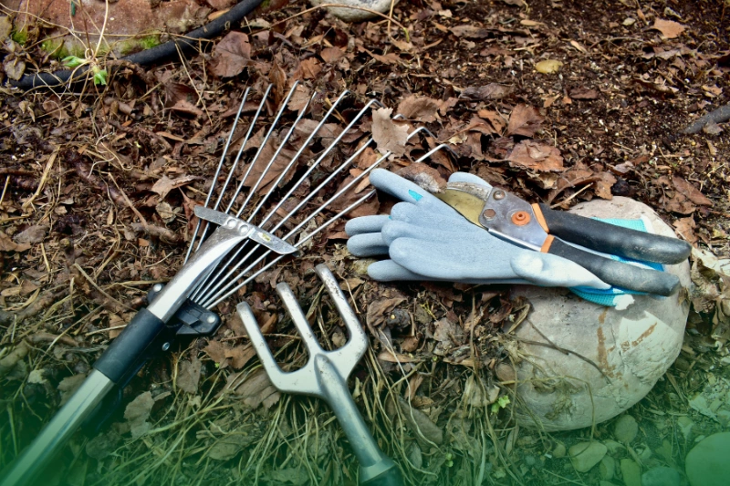 Spruce Up Your Yard_ Easy Tips for a Nice-Looking Garden Start the Year Right: Your Easy Guide to a New Year 2024_Yard clean up after winter, clearing up mulch and garden debris for seasonal growth. Photo background, landscaping work. Lifestyle hobbies